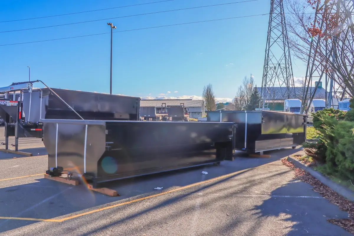 Roll-off dumpster ready for waste disposal at job site for Yard Waste Dumpster Rental in Newport